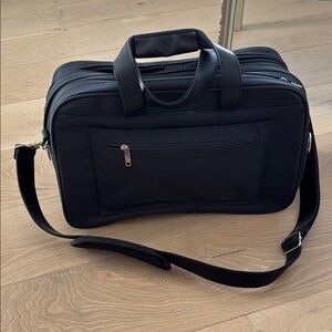 Blue Travel Bag with Adjustable Strap and Structured Shape